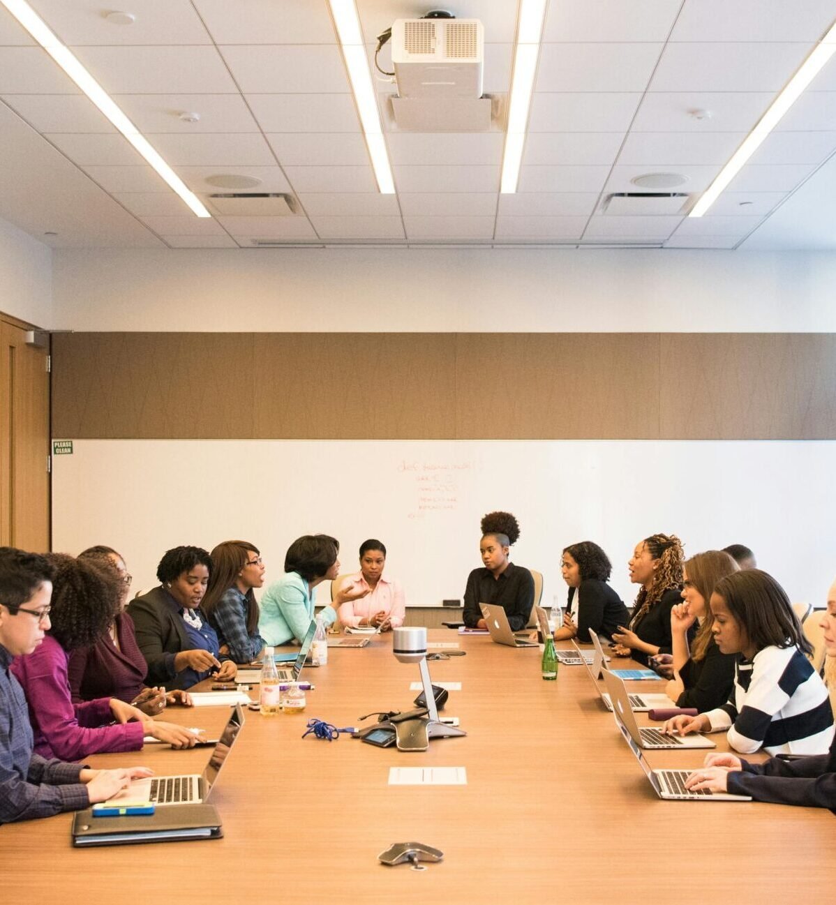 A multicultural team brainstorming and collaborating during a business meeting.